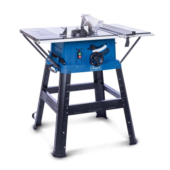 Scheppach table saw with black stand and grey worktop. The saw features a blue motor housing with a green power button.